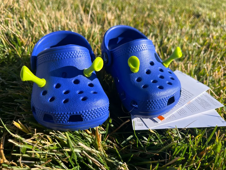 Blue crocs with discount charms